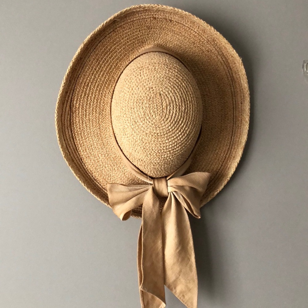 straw hat with tea stained bow